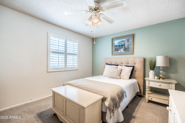 4501 E Carol Ave Unit 77, Mesa, AZ 85206 - bedroom with light colored carpet, a textured ceiling, baseboards, and ceiling fan