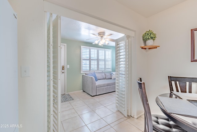 4501 E Carol Ave Unit 77, Mesa, AZ 85206 - dining room featuring a ceiling fan, light tile patterned flooring, and baseboards