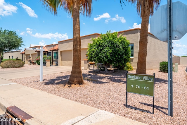 4501 E Carol Ave Unit 77, Mesa, AZ 85206 - view of property featuring driveway and a garage