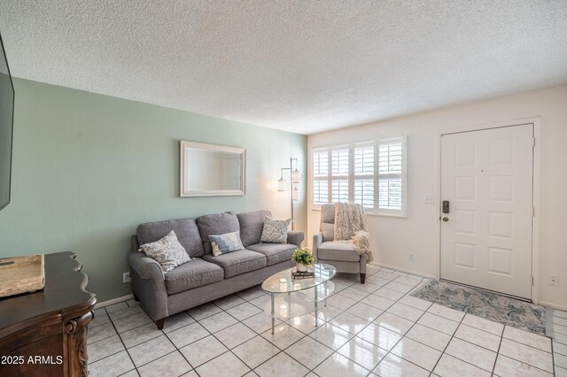 4501 E Carol Ave Unit 77, Mesa, AZ 85206 - living area with light tile patterned floors, a textured ceiling, and baseboards
