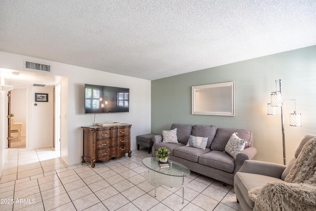 4501 E Carol Ave Unit 77, Mesa, AZ 85206 - living area with light tile patterned flooring and a textured ceiling
