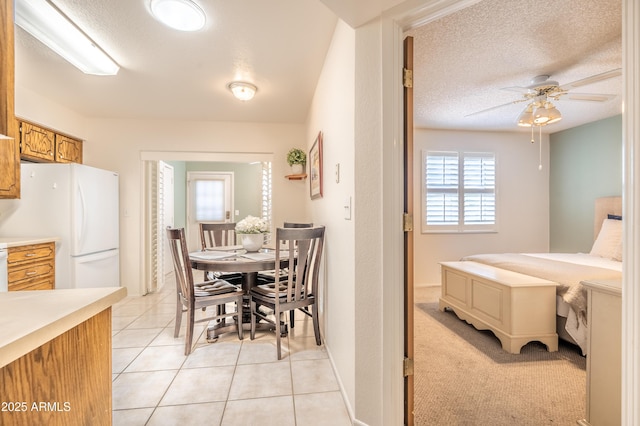 4501 E Carol Ave Unit 77, Mesa, AZ 85206 - dining area featuring a ceiling fan, light tile patterned flooring, and a textured ceiling