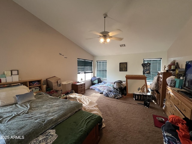 bedroom with carpet floors, visible vents, ceiling fan, and high vaulted ceiling