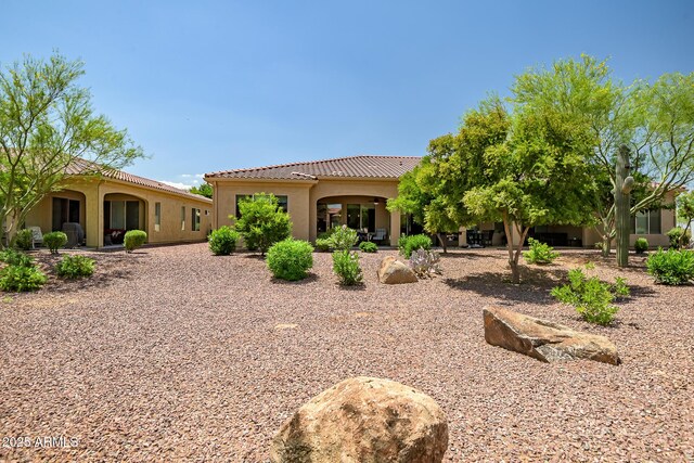16426 W Piccadilly Rd, Goodyear, AZ 85395 - back of house featuring a tiled roof and stucco siding
