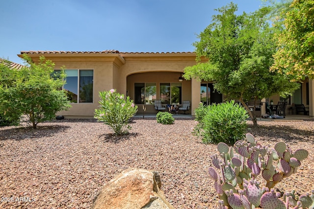 16426 W Piccadilly Rd, Goodyear, AZ 85395 - rear view of property with a patio area, stucco siding, and a tiled roof