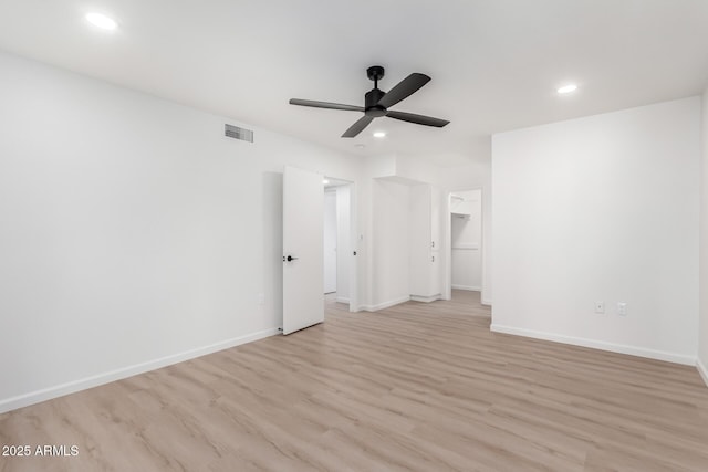 unfurnished room with ceiling fan and light hardwood / wood-style floors