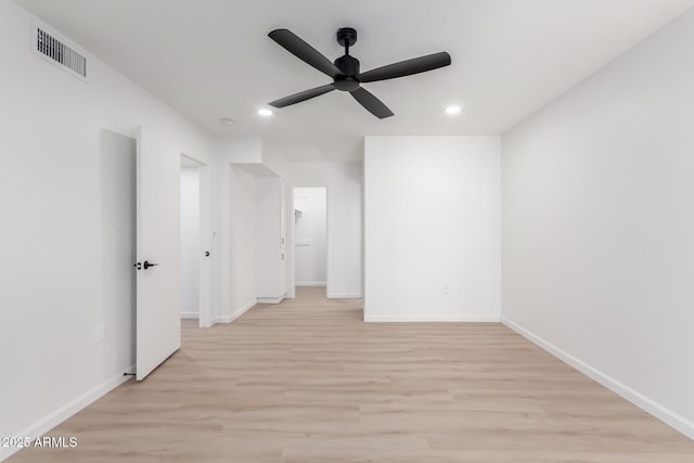 unfurnished room featuring ceiling fan and light hardwood / wood-style floors