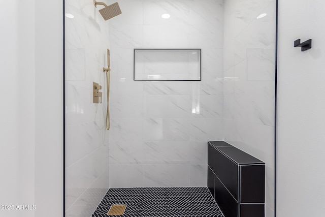 bathroom featuring tiled shower