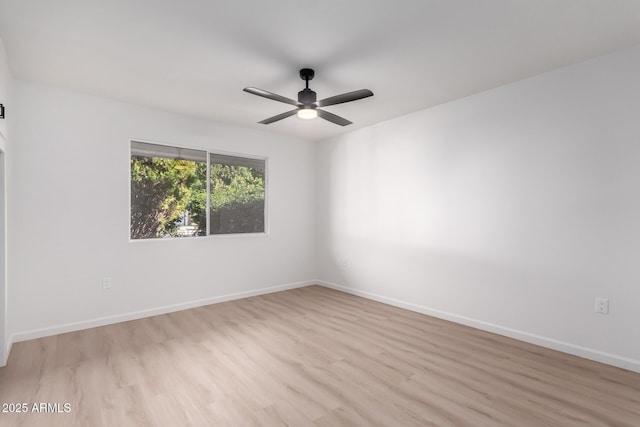 unfurnished room with ceiling fan and light wood-type flooring