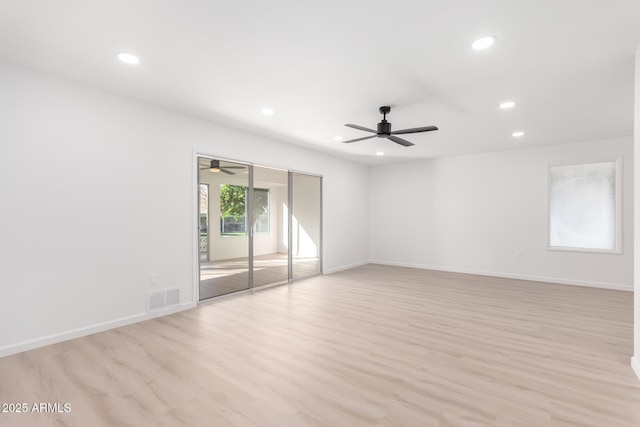 unfurnished room with ceiling fan and light hardwood / wood-style floors