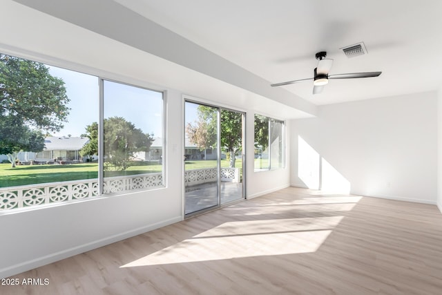 spare room featuring light wood-type flooring and ceiling fan