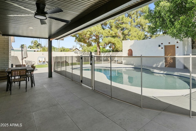 view of swimming pool with a ceiling fan, a fenced backyard, a fenced in pool, and a patio area