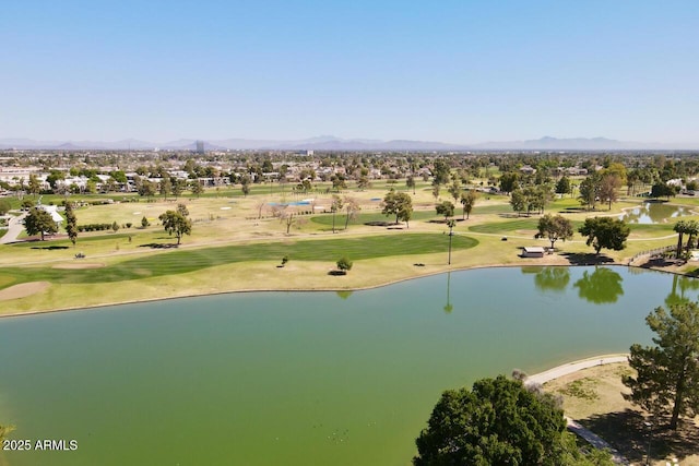 birds eye view of property with view of golf course and a water and mountain view
