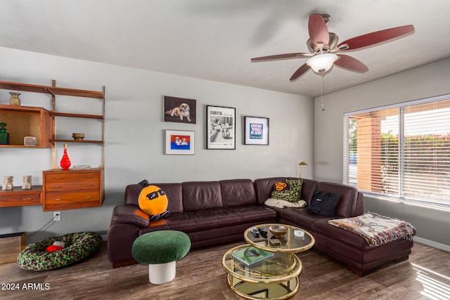 living room featuring hardwood / wood-style flooring and ceiling fan