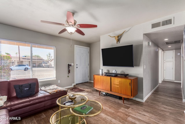 living room with hardwood / wood-style floors and ceiling fan