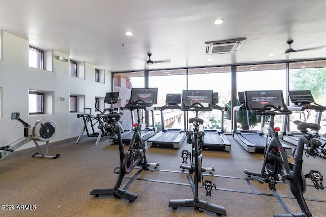 exercise room with ceiling fan