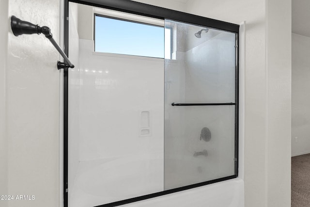 full bathroom featuring a shower with shower door