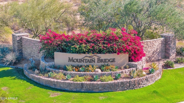 community / neighborhood sign with a lawn