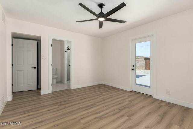 2240 W Cheery Lynn Rd, Phoenix, AZ 85015 - unfurnished bedroom featuring access to outside, ensuite bathroom, a ceiling fan, light wood finished floors, and baseboards