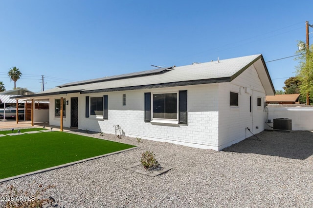 2240 W Cheery Lynn Rd, Phoenix, AZ 85015 - view of front facade with brick siding, solar panels, cooling unit, and a patio