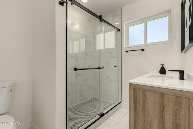 2240 W Cheery Lynn Rd, Phoenix, AZ 85015 - bathroom featuring baseboards, toilet, vanity, a marble finish shower, and marble finish floor