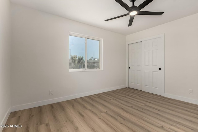 2240 W Cheery Lynn Rd, Phoenix, AZ 85015 - unfurnished bedroom with ceiling fan, a closet, light wood finished floors, and baseboards