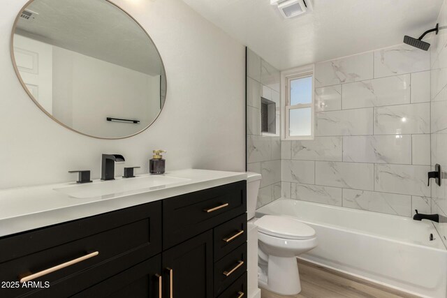 2240 W Cheery Lynn Rd, Phoenix, AZ 85015 - bathroom with visible vents, toilet, tub / shower combination, vanity, and wood finished floors