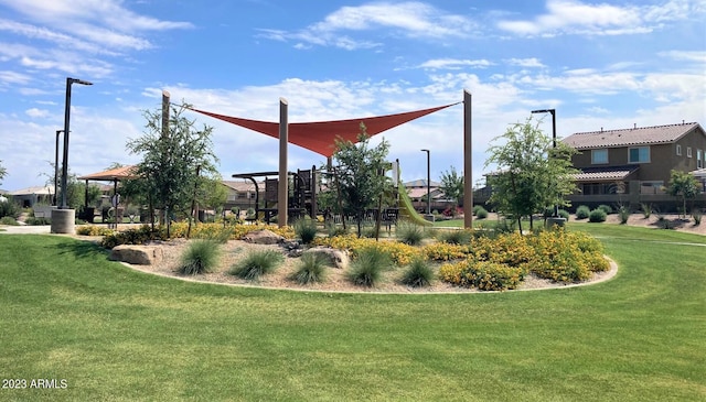 view of property's community with a lawn