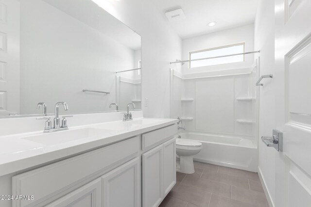 full bathroom featuring tile patterned floors, vanity, shower / bathtub combination, and toilet