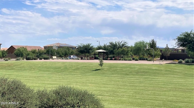 surrounding community with a gazebo and a lawn