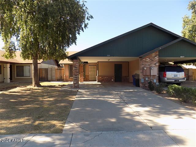 view of front of home featuring a carport