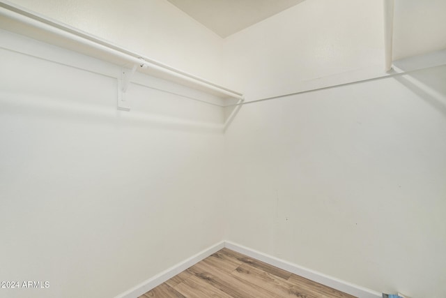 spacious closet featuring hardwood / wood-style floors