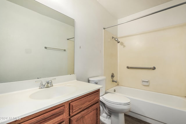 full bathroom with vanity, toilet, wood-type flooring, and bathtub / shower combination