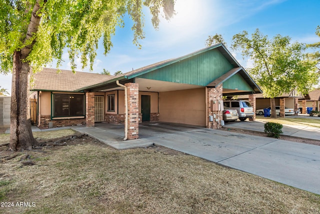 view of front of home featuring a carport