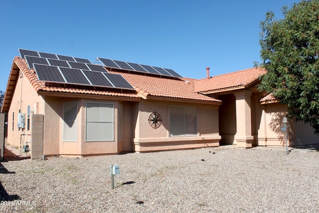 view of front of house featuring solar panels