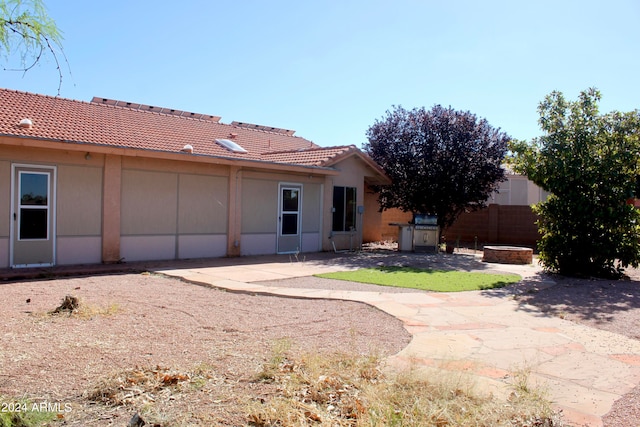 back of house featuring a patio area