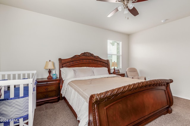 carpeted bedroom with ceiling fan