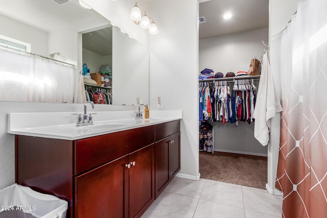 bathroom with tile flooring and vanity