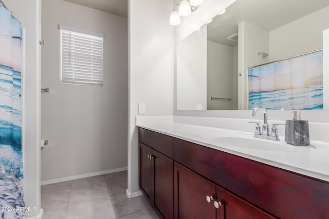 bathroom featuring vanity and tile floors