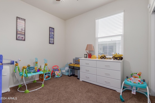 recreation room with ceiling fan and carpet floors