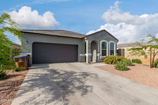 mediterranean / spanish-style house featuring a garage