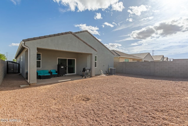 back of house with central AC unit and a patio area