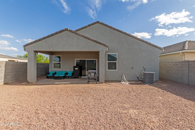 rear view of property featuring central AC and a patio