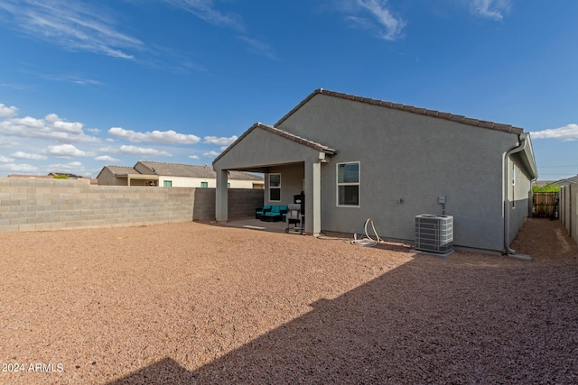 back of property featuring a patio and central air condition unit