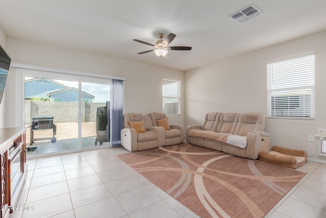 living room with ceiling fan and light tile floors