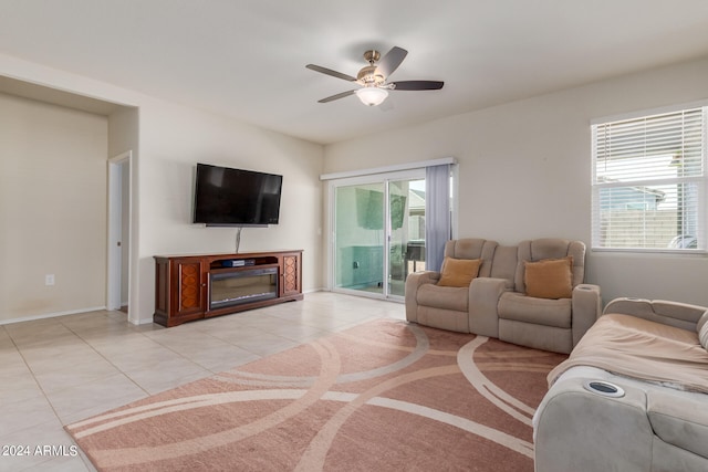 tiled living room with ceiling fan