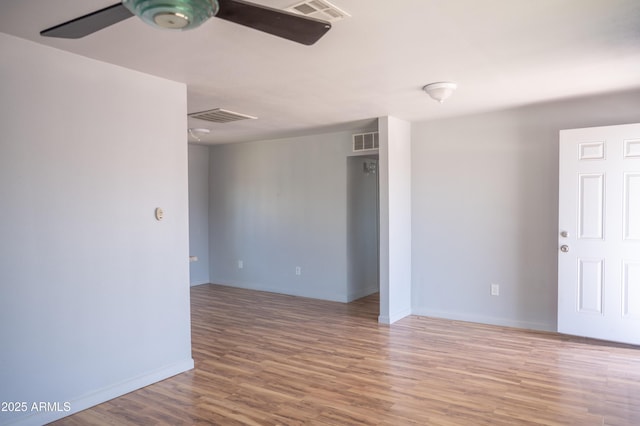 1410 S 24th Ave, Phoenix, AZ 85009 - empty room featuring visible vents, ceiling fan, and wood finished floors