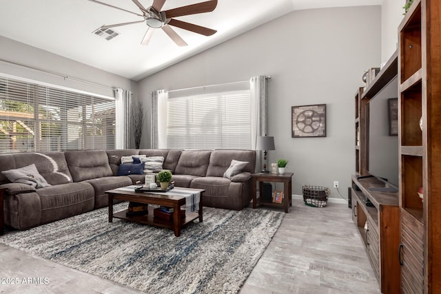 living room with baseboards, high vaulted ceiling, visible vents, and a ceiling fan