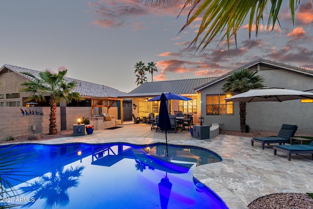 view of pool with a fenced in pool, fence private yard, and a patio area