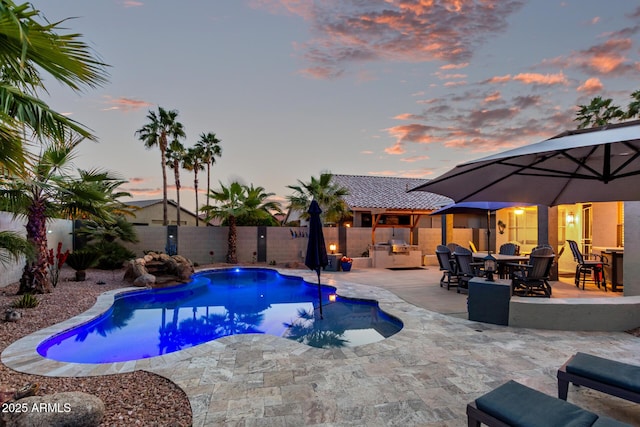 view of swimming pool with a patio, a fenced backyard, and a fenced in pool